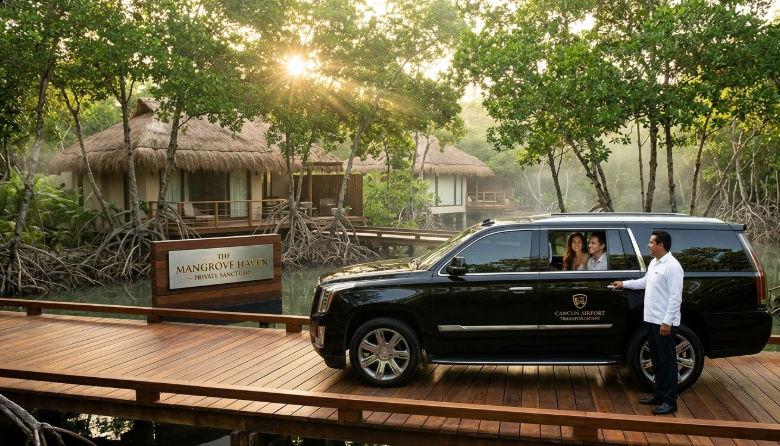 Premium arrival at the ultra luxury hideout in the mangroves with private transportation. Luxury black SUV from CANCUN AIRPORT TRANSPORTATION arriving at a hidden mangrove resort in the Riviera Maya.
