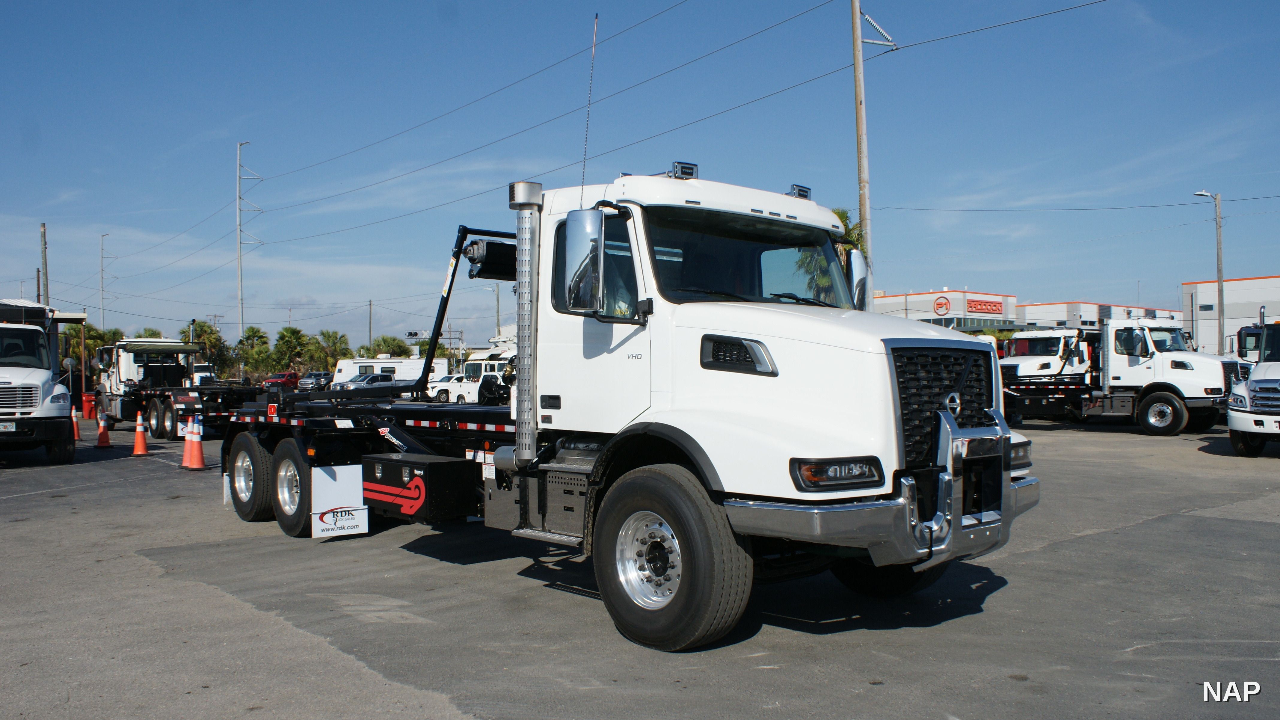 2026 Volvo VHD64B roll-off truck with 60,000 lb PacMac hoist