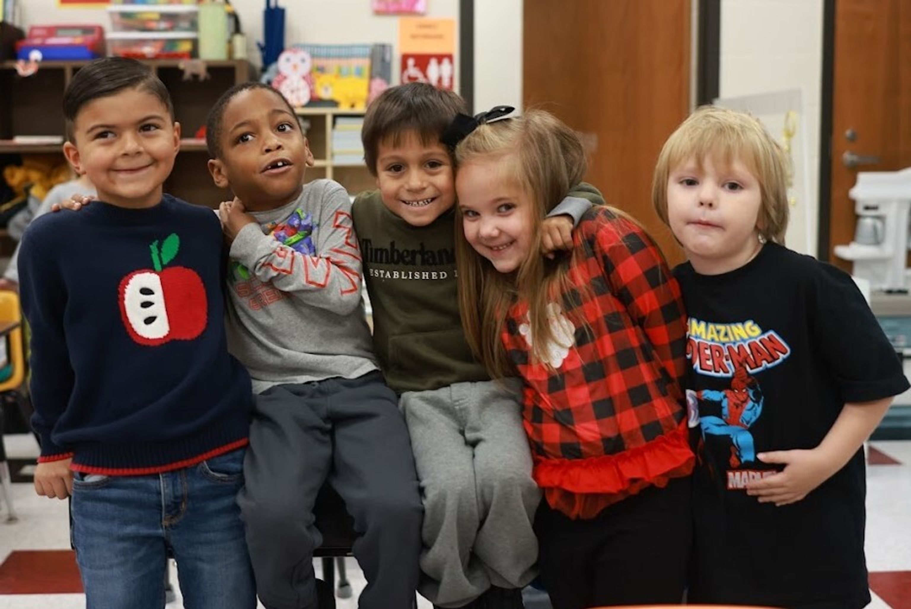 Children standing in a group smiling