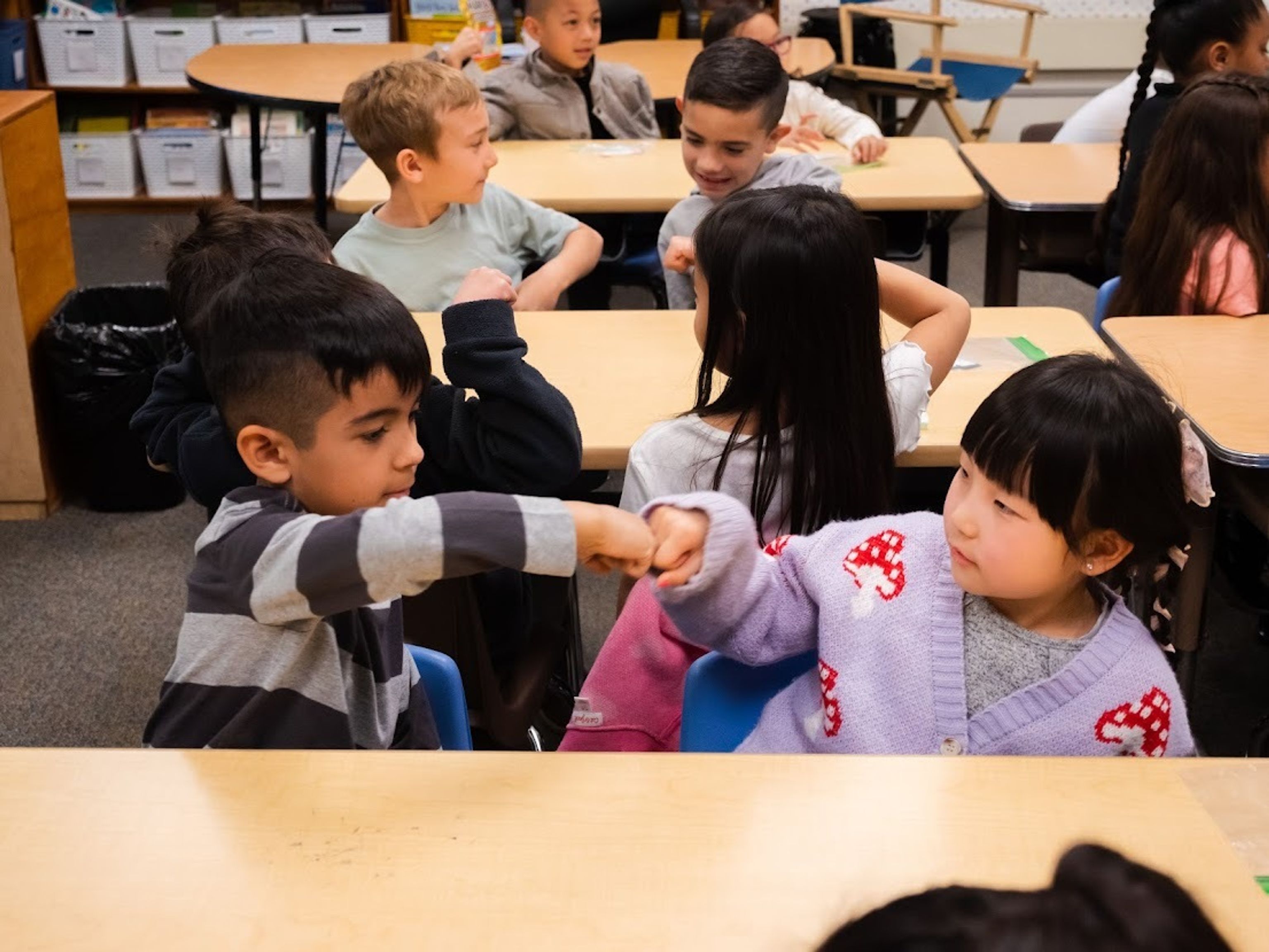 Students fist bump at Shull Elementary School