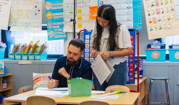 Teachers prepare lesson for phonics instruction