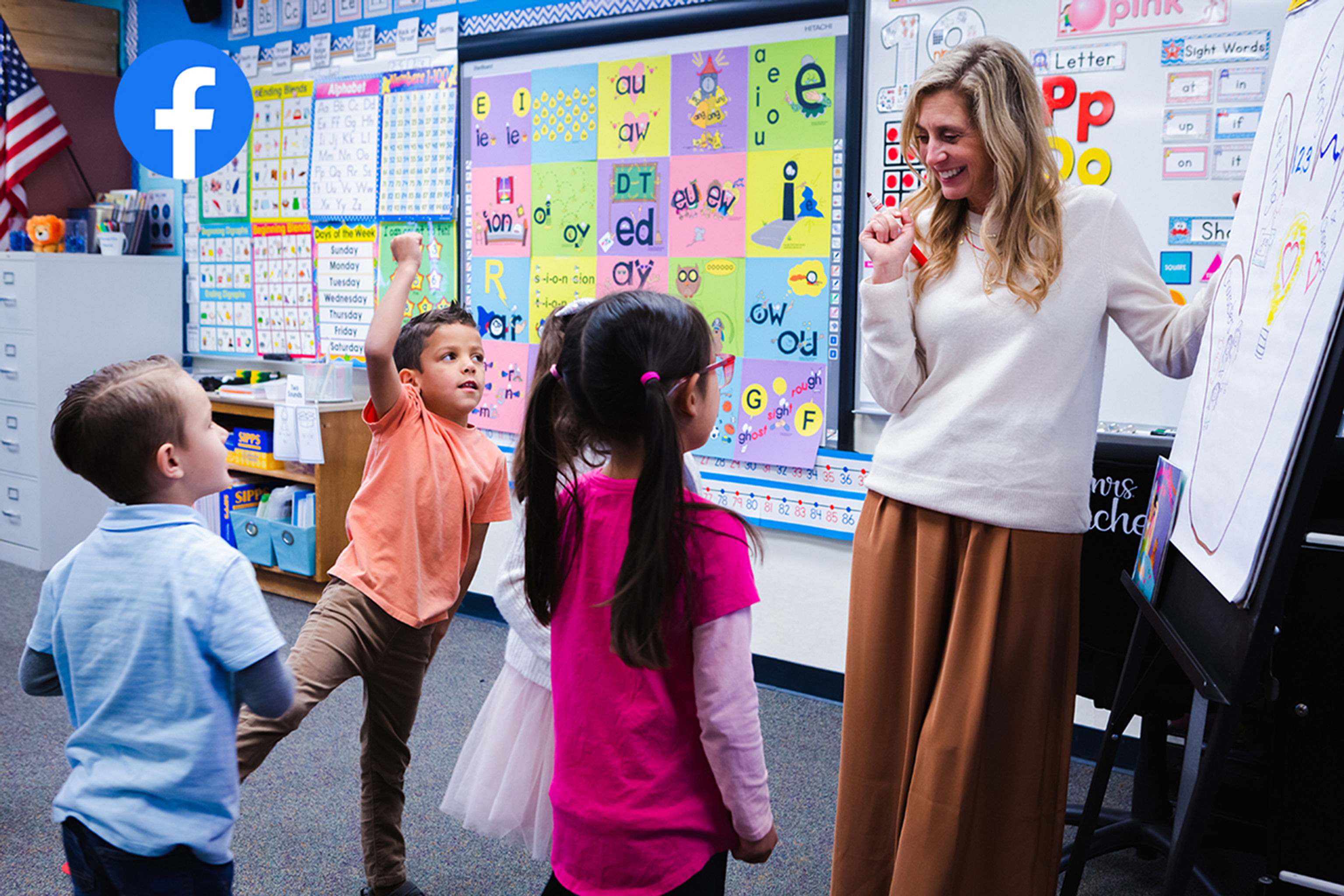 Students and teacher at a classroom easel