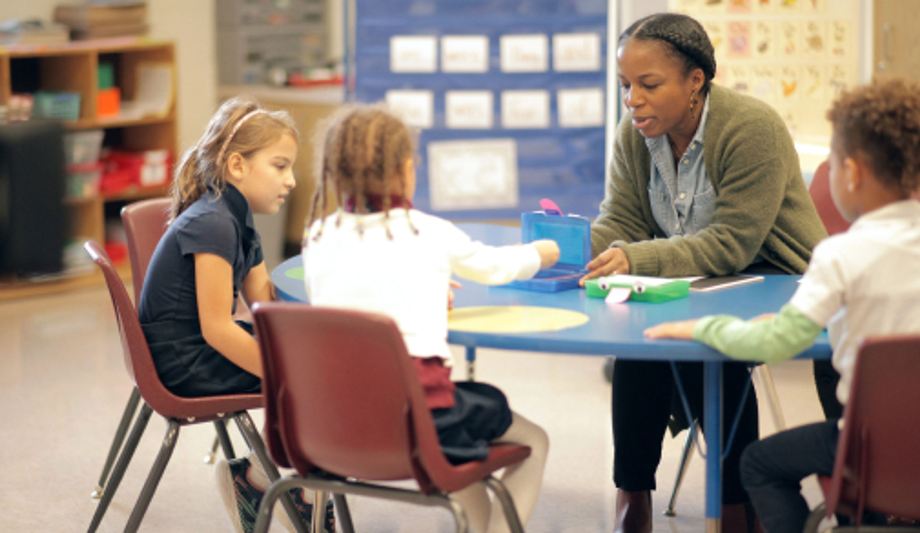 teacher working with a small group of students