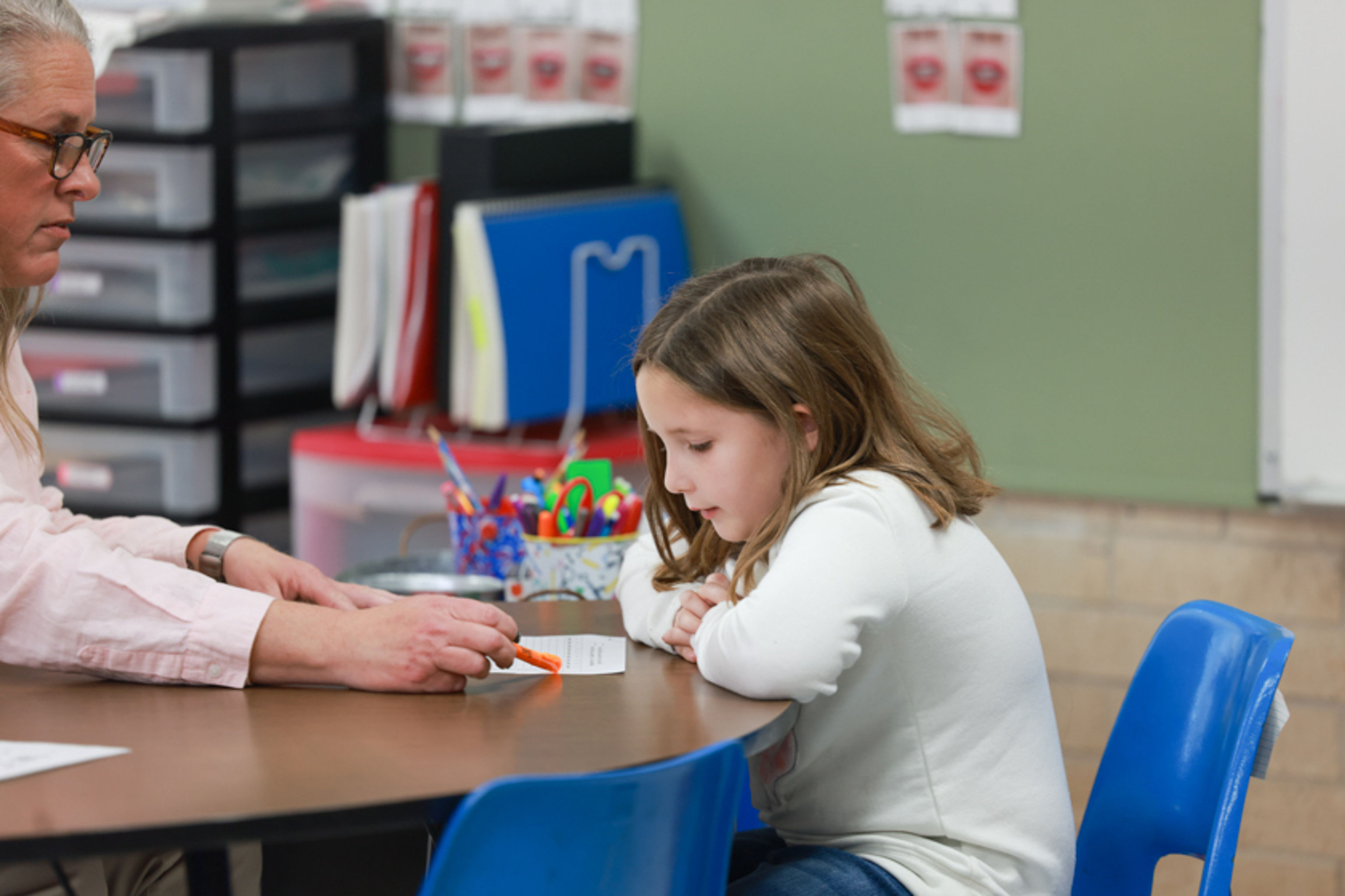 Teacher assesses individual student