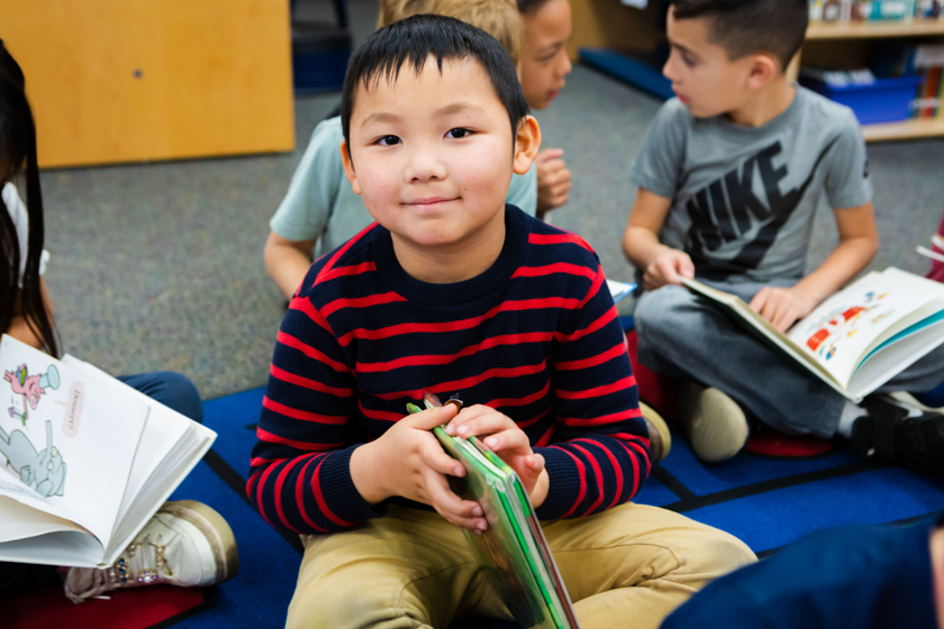 Young student holding a book