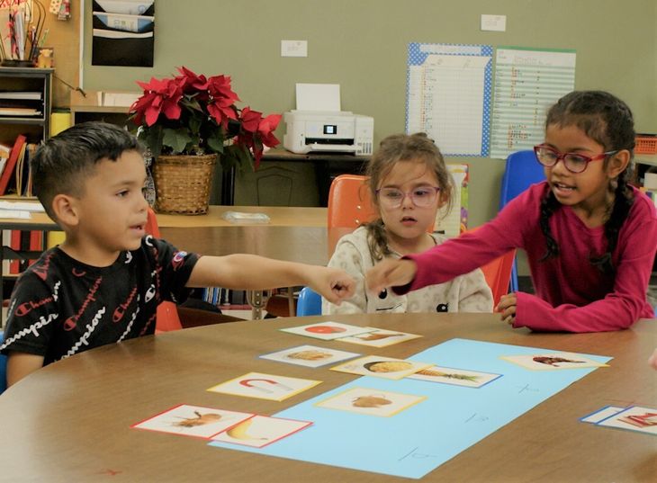 Students identify phonemes using picture cards