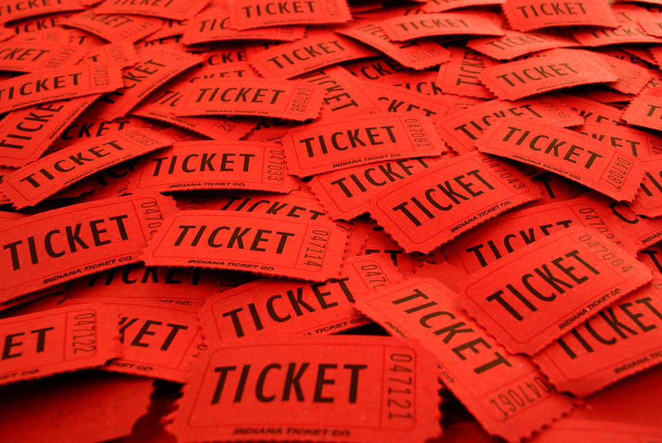 Pile of tickets used for entering an event