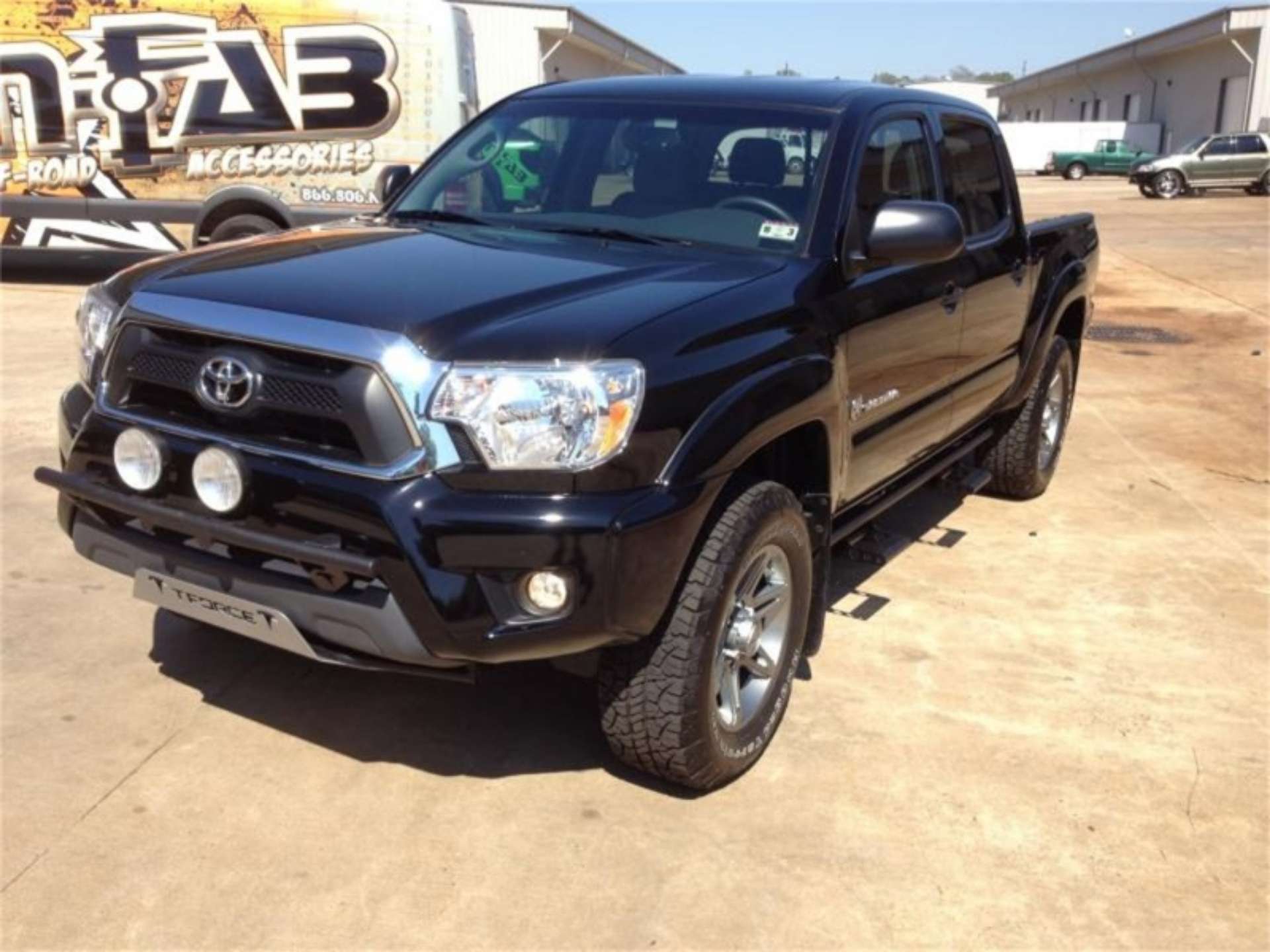 Picture of N-Fab Light Bar 12-15 Toyota Tacoma - Gloss Black - Light Tabs w-o License Plate Tabs