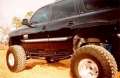 Picture of N-Fab Nerf Step 00-06 Chevy-GMC Tahoe-Yukon-Sonora SUV 4 Door - Gloss Black - W2W - 3in