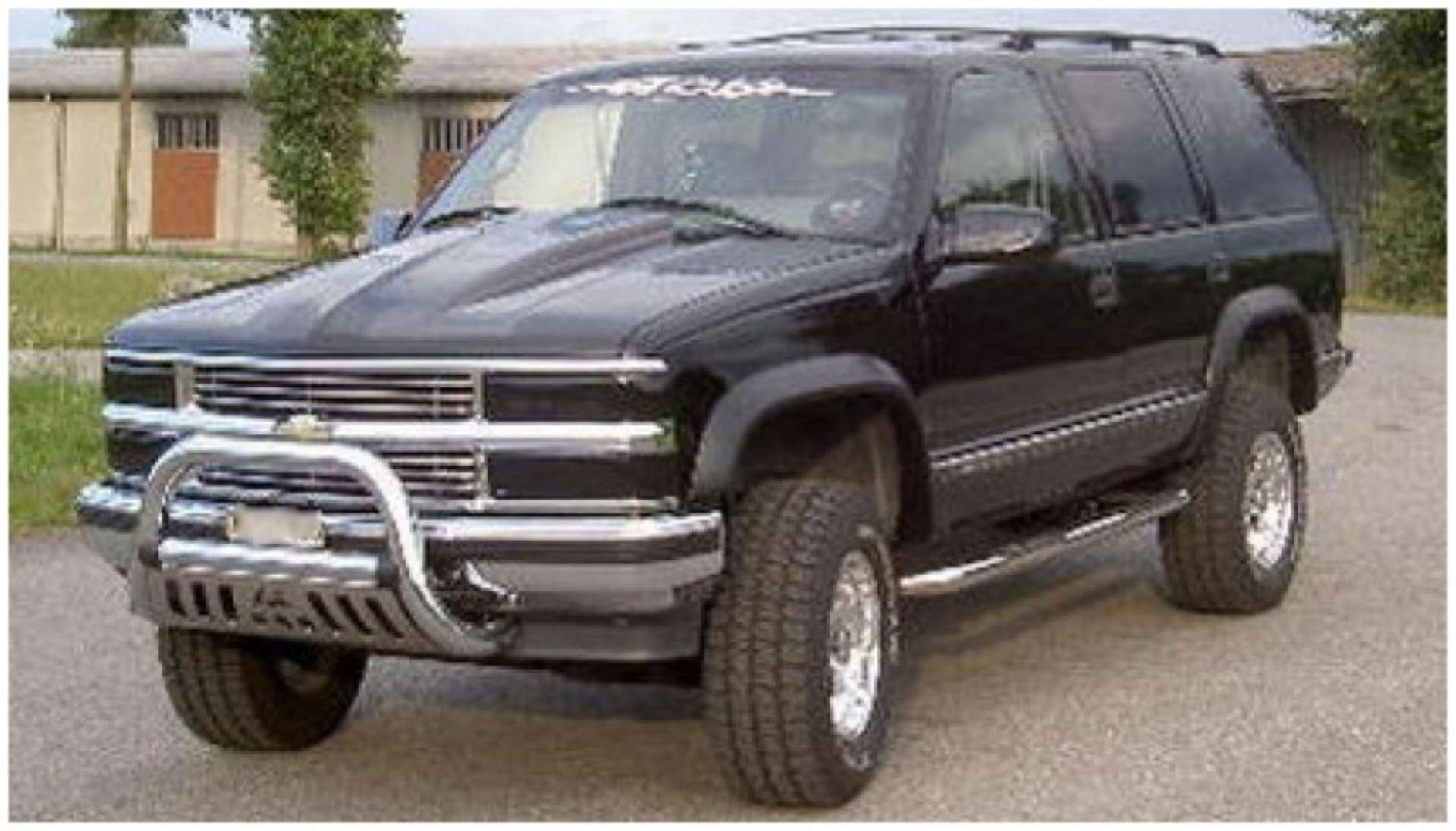 Picture of Bushwacker 97-99 Chevy Tahoe Extend-A-Fender Style Flares 4pc 4-Door Only - Black