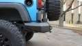 Picture of Road Armor 07-17 Jeep Wrangler JK Stealth Rear Non-Winch Bumper w-Tire Carrier - Tex Blk