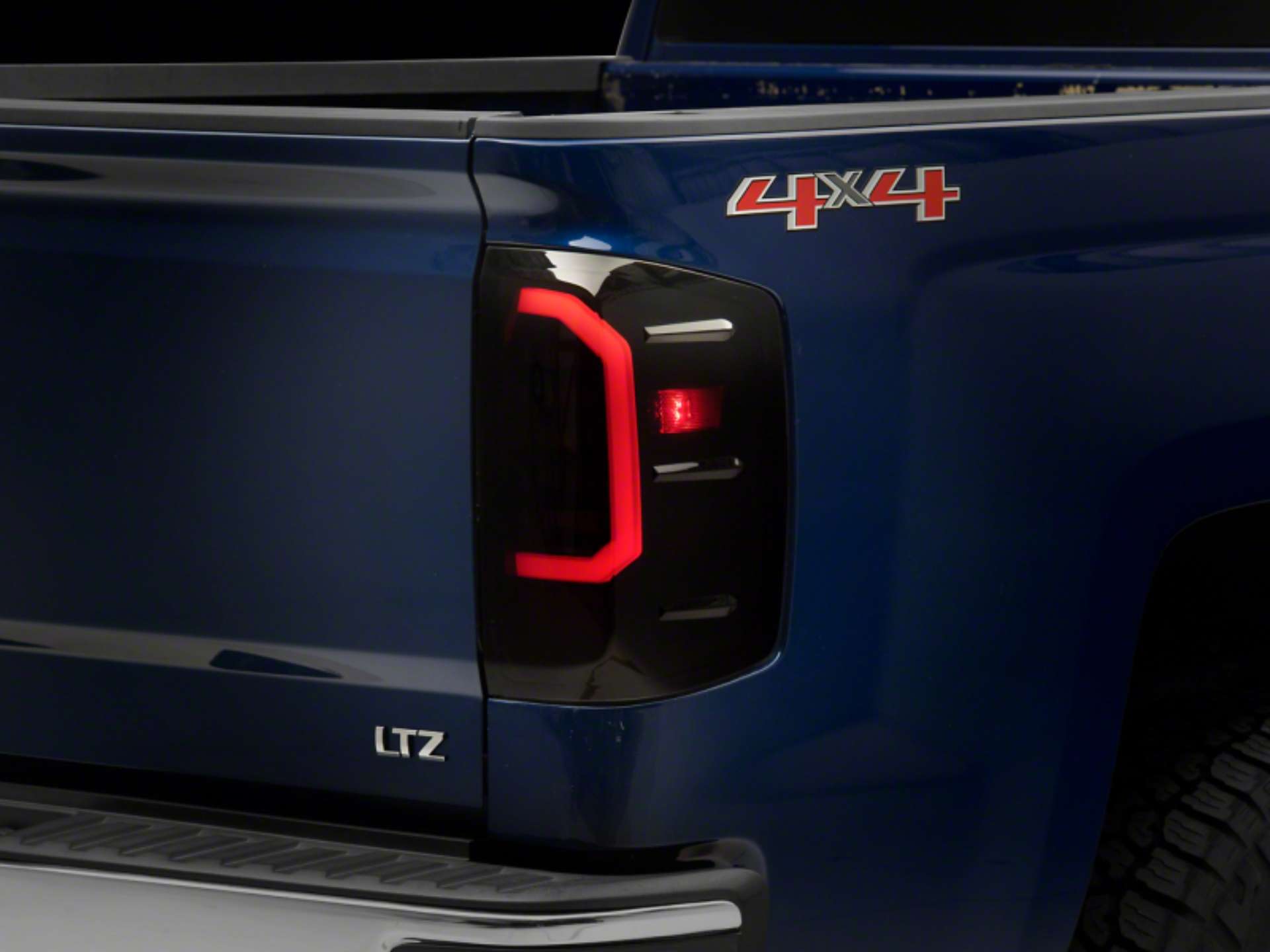 Picture of Raxiom 14-18 Chevrolet Silverado 1500 Axial Series LED Tail Lights- Blk Housing Smoked Lens