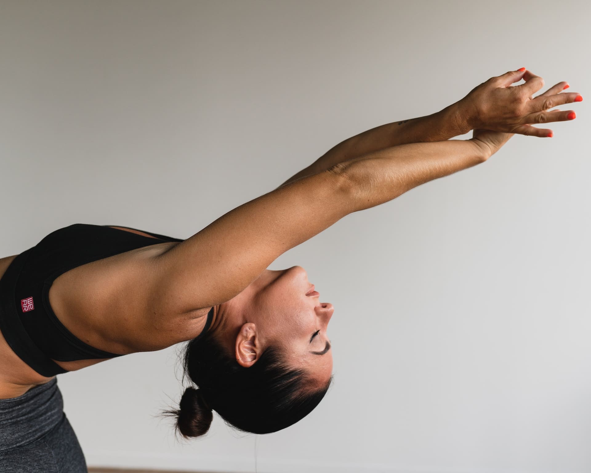 Woman in white sports bra and black leggings doing yoga photo – Free  Wellness Image on Unsplash