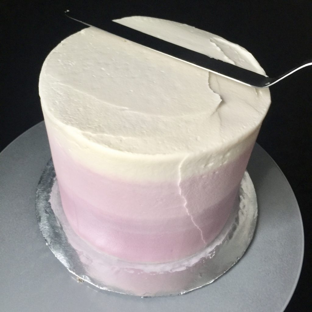 Smoothing the top of the cake