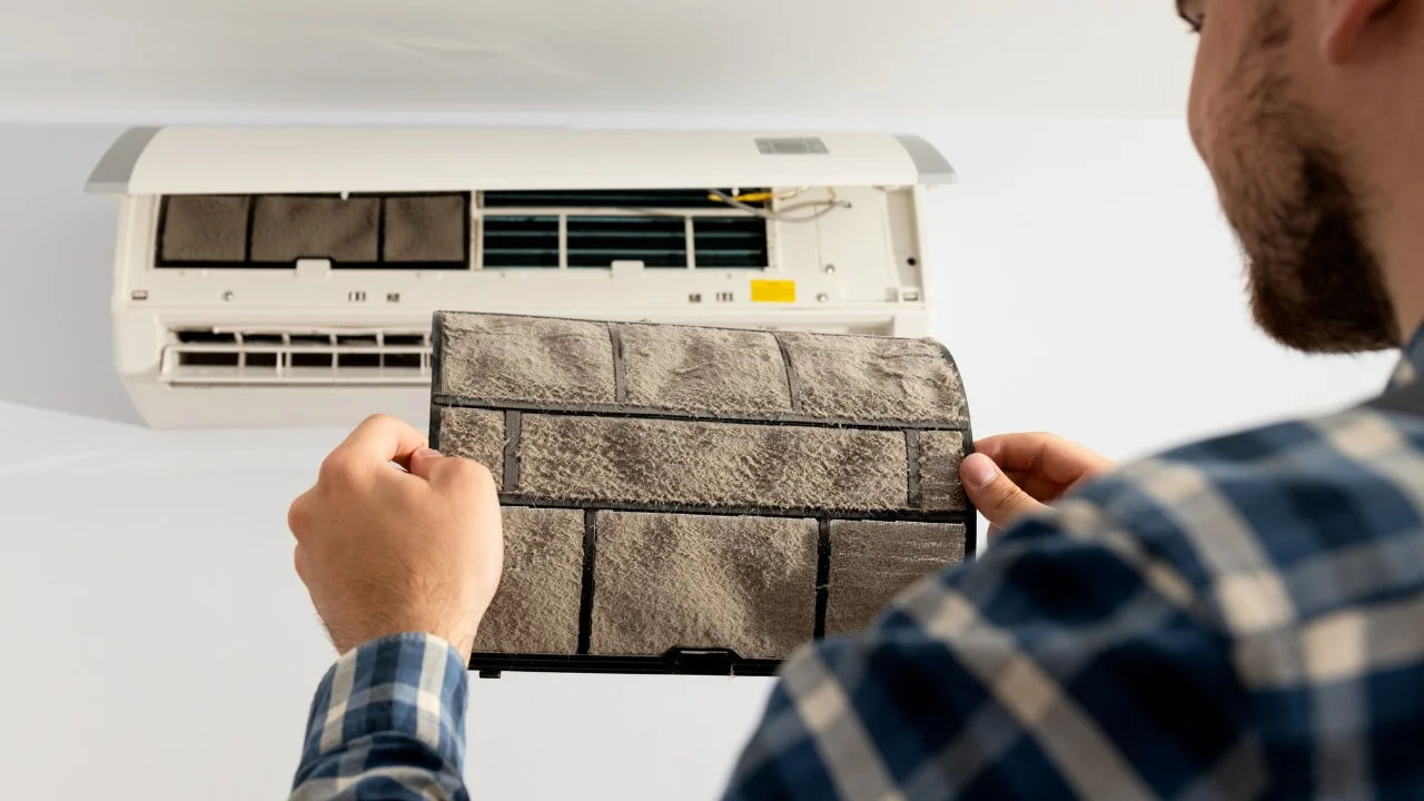 Participants learn AC repair during a hands-on session in Delhi, India.