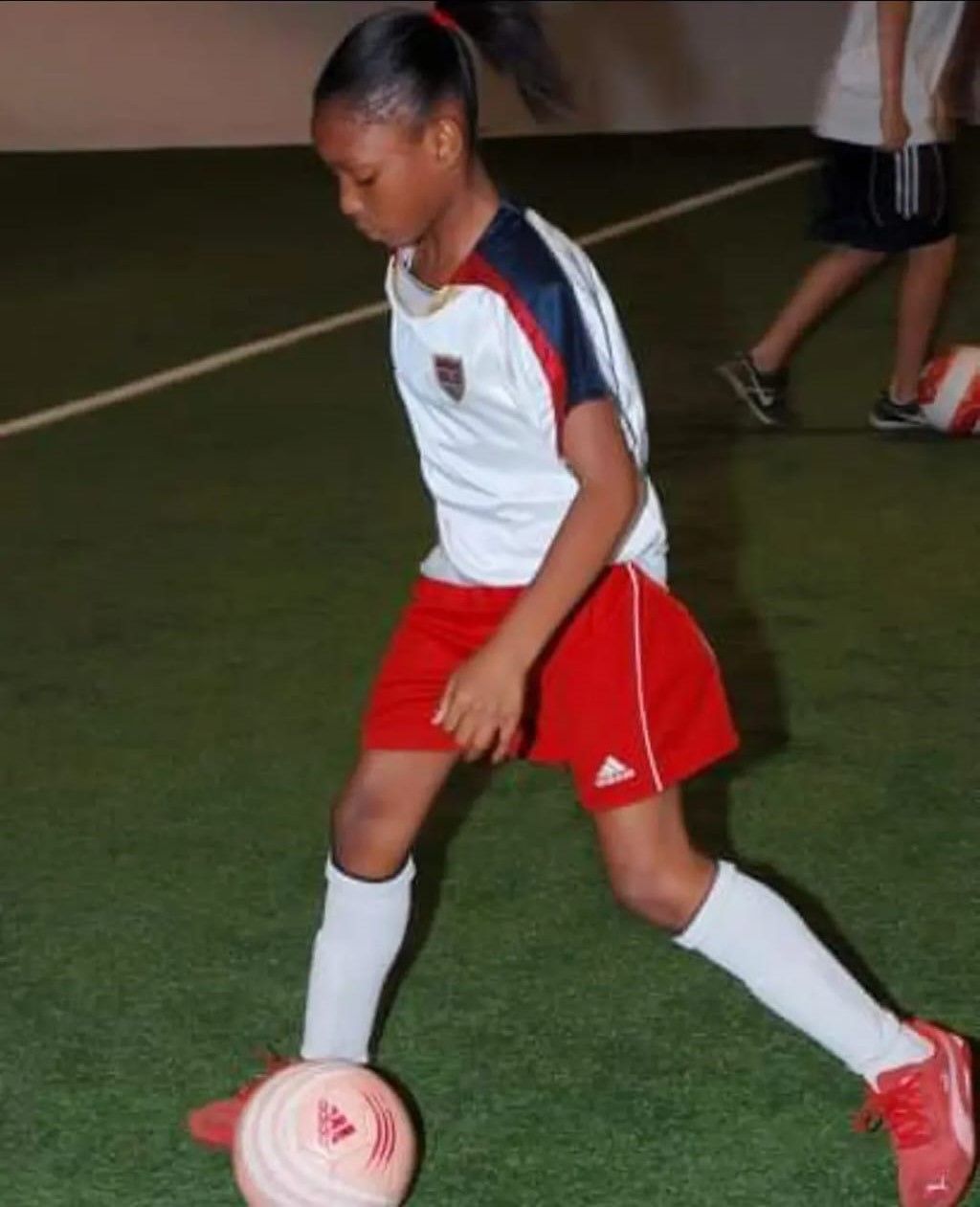 Football player dribbling