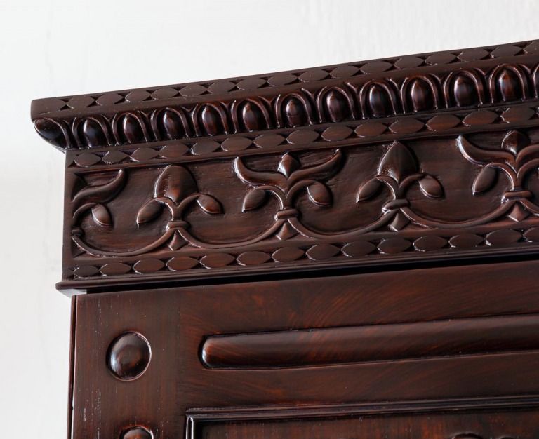 Frieze of British colonial rosewood cupboard carved with Fleur-de-Lis.