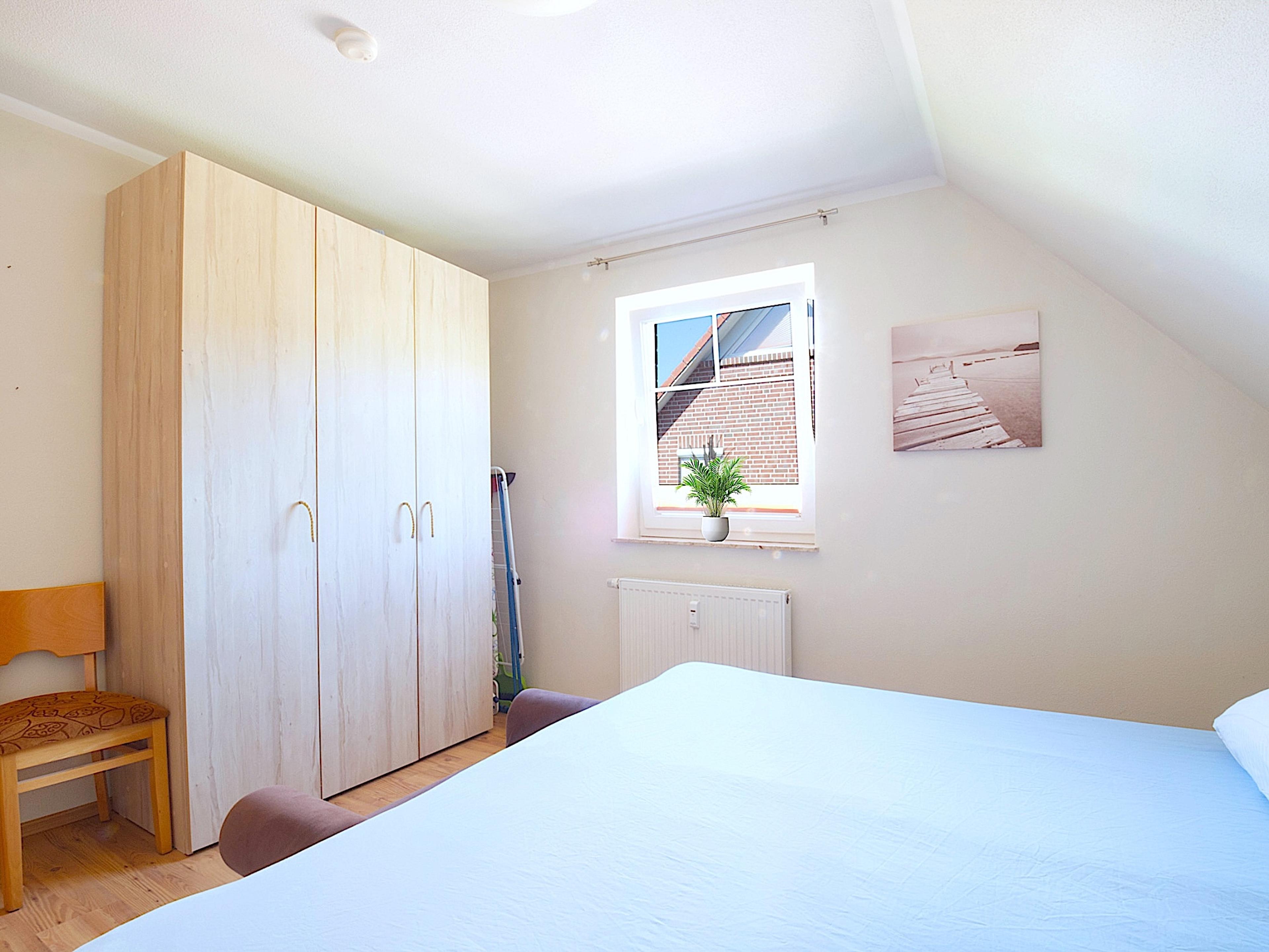 Haus Glückstal, Ferienwohnung 06, großes Schlafzimmer mit Doppelbett
