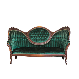 green velvet vintage sofa with dark wood trim and legs 