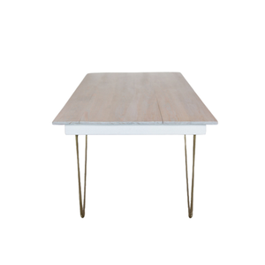 white table with gold legs 
