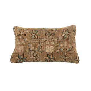 Turkish rug pillow with floral pattern
