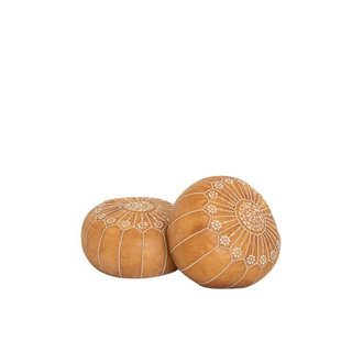 Moroccan style leather pouf in buttery tan with white stiching detail