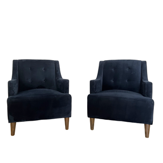 Navy blue velvet chairs with dark wood tapered feet