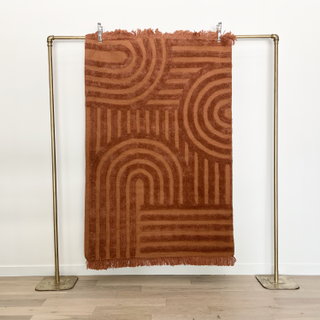 Rust and peach patterned rug
