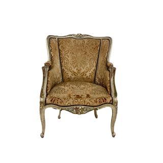 Antique chair in shabby gold yellow brocade