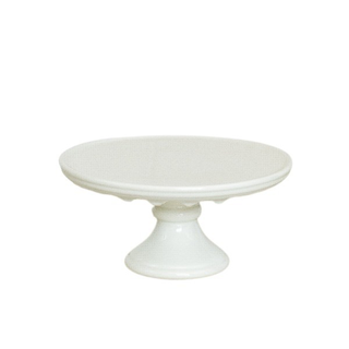 White cake stand with detailed scrolling lip