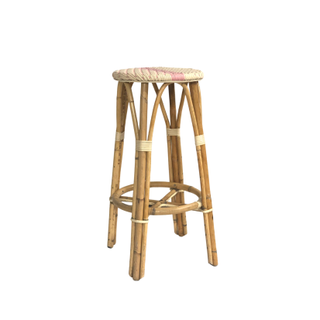 French bistro bar stools with woven white and pink plastic seating and bamboo legs 