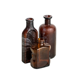 Vintage brown glass bottles in assorted sizes