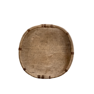 Large woven basket with metal detail.