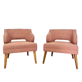 Salmon pink upholstered chairs with birch tone wooden legs