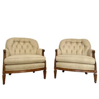 Creamy pale yellow tufted back chairs with wood legs