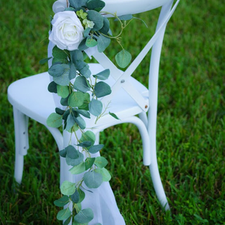 White plastic chairs with cross back 