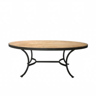 Wood coffee table with boho floral arrangement on top of jute rug for lounge area at Lewiswood Farms wedding.