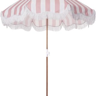 Pink stripe patio umbrella with fringe.