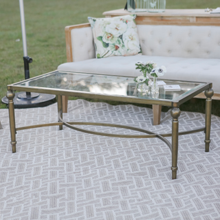 Metal coffee table for on top of rug for outdoor wedding reception lounge setting.