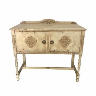 Peter Rabbit baby shower with wild flowers on top vintage table.