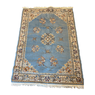 Light blue and ivory persian rug
