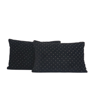 Set of black velvet lumbar pillows with white X pattern dotted throughout