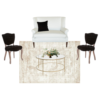 lounge set with ivory beige loveseat with a gold round coffee table with vintage velvet black chairs with wood legs on either side of the coffee table on a beige ivory rug.