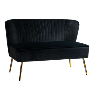 Modern velvet black loveseat with gold legs in a lounge with a white and gold sofa, black modern and gold chairs and a square gold coffee table. 