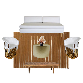 ivory beige sofa with a gold round coffee table with rattan boho and white chairs on either side of the coffee table on a rust colored pattern rug with bench.