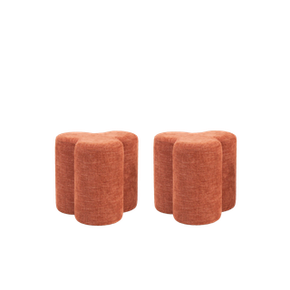 pair of pink clover pouf ottomans for events
