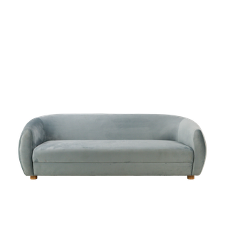 back view of curved dusty blue velvet sofa event rental
