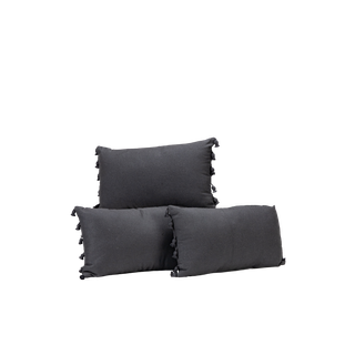 trio of black lumbar pillows with black tassels on the sides