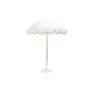 white umbrella with fringe trim in a white scalloped base