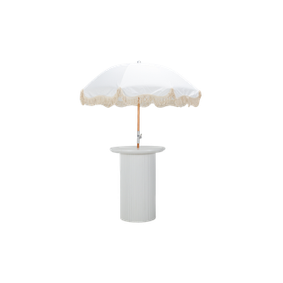 white cocktail table featuring a round top and ribbed texture with a white fringe umbrella